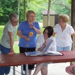 Bev Conkle, Carol Wise, Joyce Dunham, Iris Bowers looking at Lima Chapter Scrapbook. Historian: Andrea Nameche (June 2011)