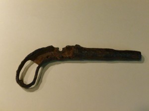 The remains of a single-shot muzzle loading pistol.